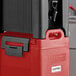A red and black CaterGator insulated beverage dispenser on a counter.