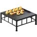 A Cal-Mil black metal square riser with food on it.