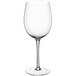 A close-up of a clear Della Luce Maia wine glass with a stem.