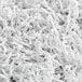 A pile of Spring-Fill white crinkle cut paper shred.