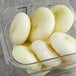 A plastic jar of peeled white Cipollini onions.