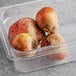 A plastic container of fresh gold beets.