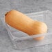 Fresh butternut squash in a plastic container.