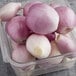 A plastic jar of peeled shallots.