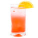 A Libbey cooler glass filled with orange liquid and a slice of orange.