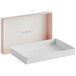 A white box with a pink lid.