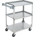 A silver Vollrath stainless steel utility cart with three shelves and wheels.