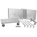 A stainless steel Vollrath utility cart with three shelves and wheels.