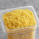 A plastic container of Barilla Fideo Pasta noodles.