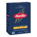 A blue box of Barilla Cut Spaghetti on a white background.