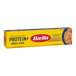 A yellow box of Barilla Protein+ Angel Hair Pasta with white text.