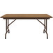 A brown rectangular Correll folding table with metal legs and a wood surface.