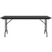 A black Correll rectangular folding table with black legs.