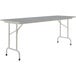 A rectangular gray Correll folding table with gray legs.