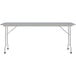 A rectangular gray granite Correll folding table with gray legs.