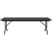 A black Correll rectangular folding table with adjustable legs.