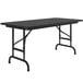 A black rectangular Correll folding table with metal legs.