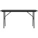 A black Correll rectangular folding table with metal legs.