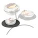 A Vollrath round adapter plate with sushi rolls on it.
