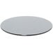A round smoke tempered glass buffet board on a white background.