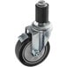 A black Backyard Pro stem caster with black rubber wheels.