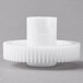 A white plastic gear set for a Galaxy glass washer with a hole in the center.