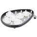 A black plastic tray holding six white plastic gears.