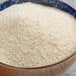 A bowl of Cream of Wheat hot cereal on a table.