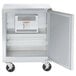 A Traulsen stainless steel undercounter freezer with a door open.