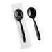 A heavy weight black plastic soup spoon, with one spoon individually wrapped in plastic and one unwrapped.