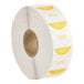 A roll of white and yellow Noble Products day of the week labels.