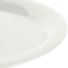 A close-up of a Carlisle bone white oval melamine platter with a round rim.