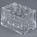 A clear glass block with a fluted edge and a lid on it.