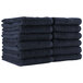 A stack of navy Monarch Brands hand towels.