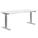 A white rectangular desk with metal legs.