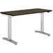 A HON Coze height-adjustable desk with a walnut top and silver legs.