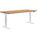 A HON Coze Coordinate natural recon and white height-adjustable desk with white legs.