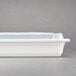 A white Pactiv rectangular microwavable container with a clear lid.