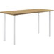 A HON Coze desk with a natural wood and white designer laminate top and white legs.