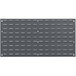 A Quantum grey steel louvered panel with rectangular holes.