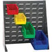 A Quantum grey steel bench rack with multicolored bins on it.