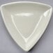 A white triangle shaped dish.