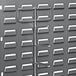 A Quantum metal rack with many small white rectangular objects hanging on it.