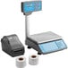A grey AvaWeigh digital scale with blue buttons and a roll of thermal paper.