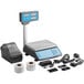 A grey and blue AvaWeigh digital price computing scale with a touch screen and thermal label printer tower.