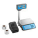 A grey AvaWeigh digital scale with a screen and blue buttons next to a black tower printer with a roll of paper tape.