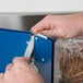 a person using a plastic bag to wrap a piece of bread