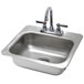 An Advance Tabco stainless steel drop-in sink on a counter.