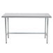 An Advance Tabco stainless steel work table with metal legs.