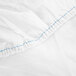 A white Monarch Brands fitted sheet with blue stitching.